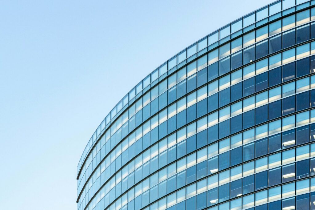 Glass facade of a commercial building illustrating business window tinting